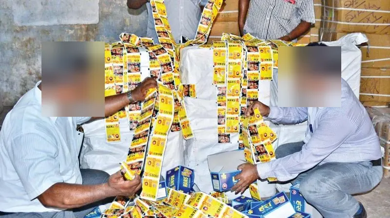 Officials sorting strips of seized Hans sachets